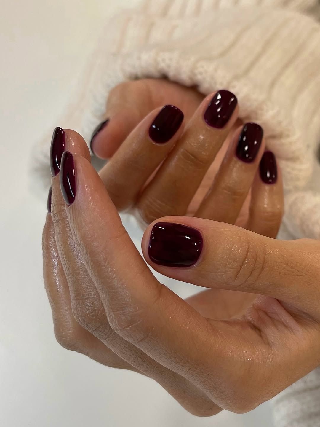 Fall manicure in deep burgundy tones