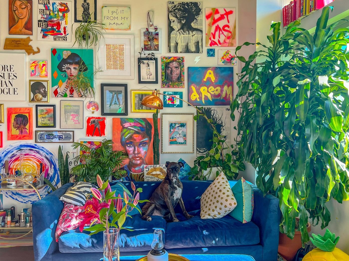 Gallery wall of graphic circus-inspired prints in red, cream, and navy frames