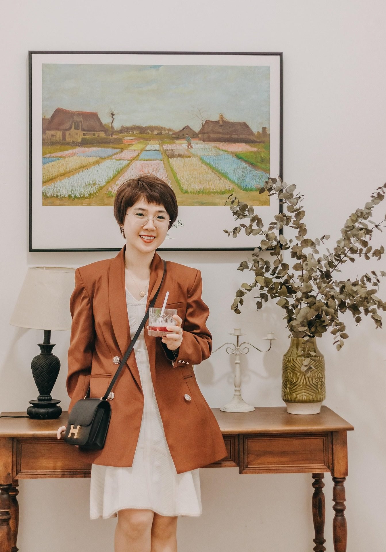 Mature woman over 50 with a short brown bob haircut at home