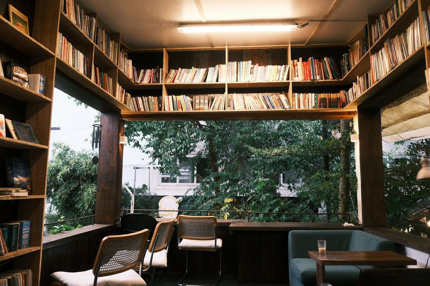 Reading nook in a small room with an armchair and bookshelf
